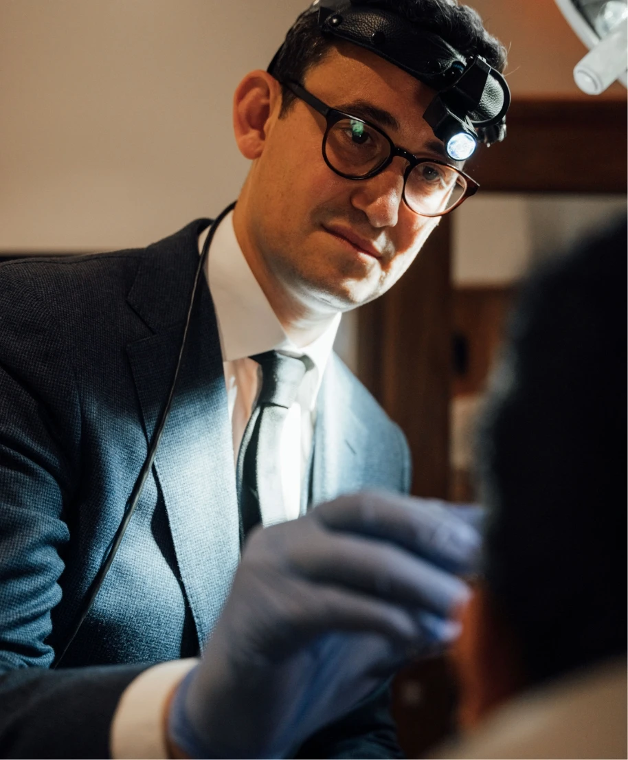 Dr. Ben Paul working with a patient