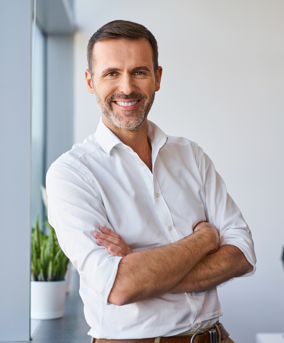 Male model arms crossed looking at the camera, Facial Trauma Surgery in NYC