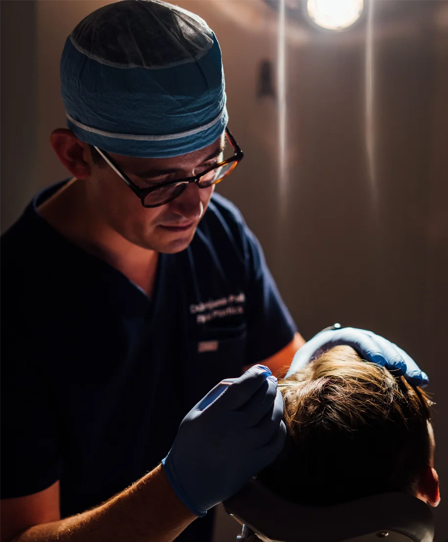 Dr. Ben Paul performing a hair transplant